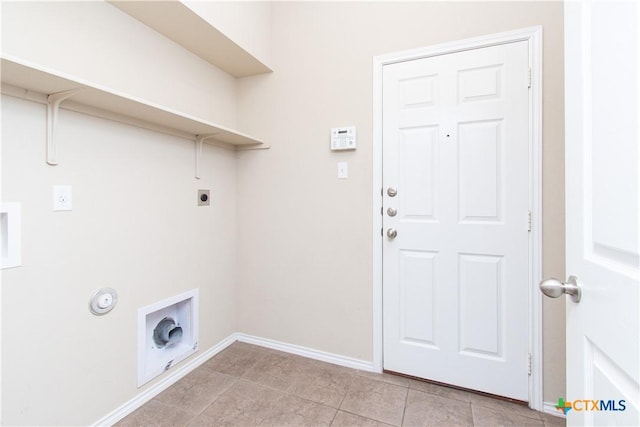 7010 Cokui Dr, Killeen, TX 76542 - laundry area with electric dryer hookup, light tile patterned floors, and hookup for a gas dryer