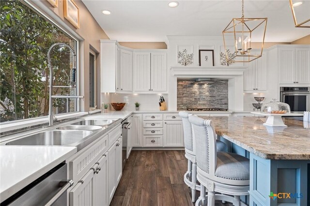 913 Southridge Rd, Salado, TX 76571 - kitchen featuring appliances with stainless steel finishes, recessed lighting, white cabinetry, tasteful backsplash, and dark wood finished floors