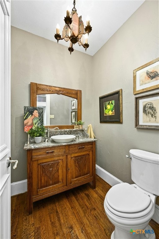 913 Southridge Rd, Salado, TX 76571 - bathroom with a chandelier, wood finished floors, and vanity
