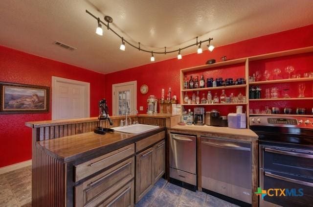 bar with appliances with stainless steel finishes and sink