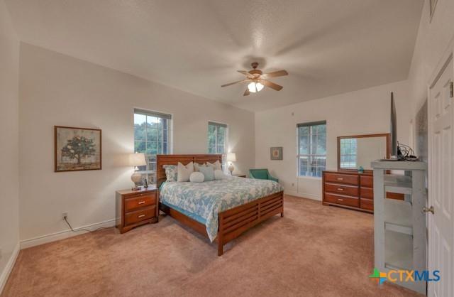 carpeted bedroom with ceiling fan