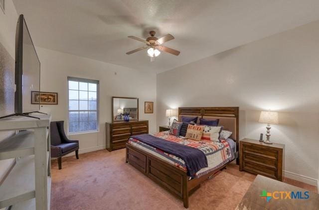 bedroom with light carpet and ceiling fan