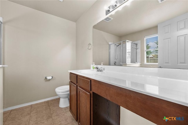 824 Starlight Dr, Temple, TX 76502 - full bathroom with a shower stall, baseboards, vanity, toilet, and tile patterned flooring