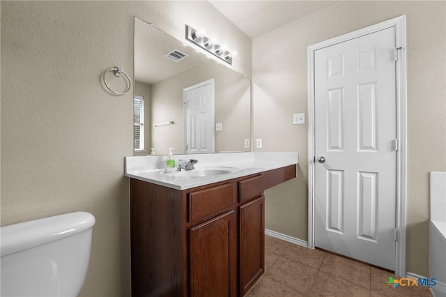 824 Starlight Dr, Temple, TX 76502 - bathroom featuring toilet, tile patterned floors, and vanity