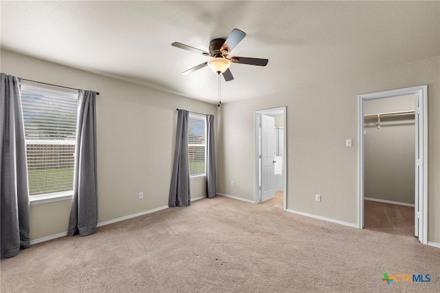 824 Starlight Dr, Temple, TX 76502 - unfurnished bedroom with light colored carpet, a spacious closet, and baseboards