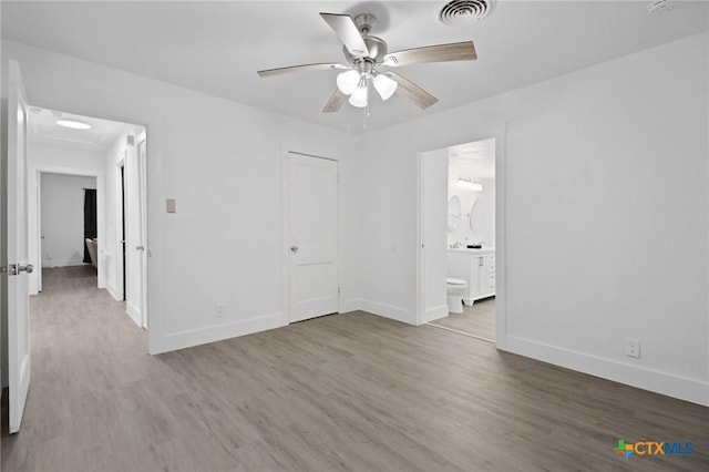 542 Williamsburg Pl, San Antonio, TX 78201 - empty room with wood finished floors, ceiling fan, and baseboards