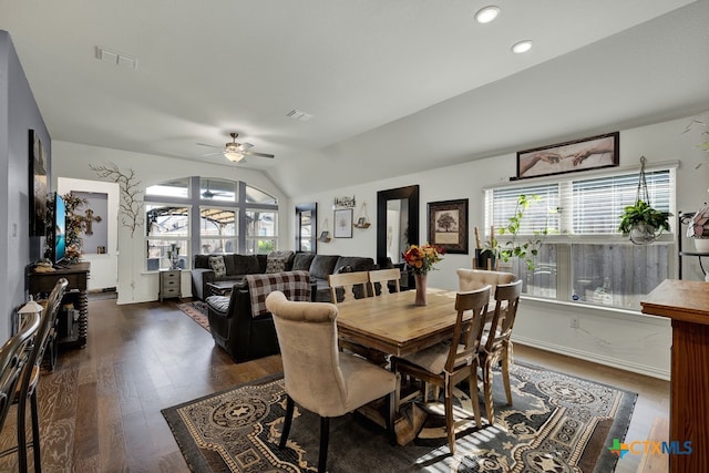 dining area featuring dark hardwood / wood-style floors, vaulted ceiling, and ceiling fan