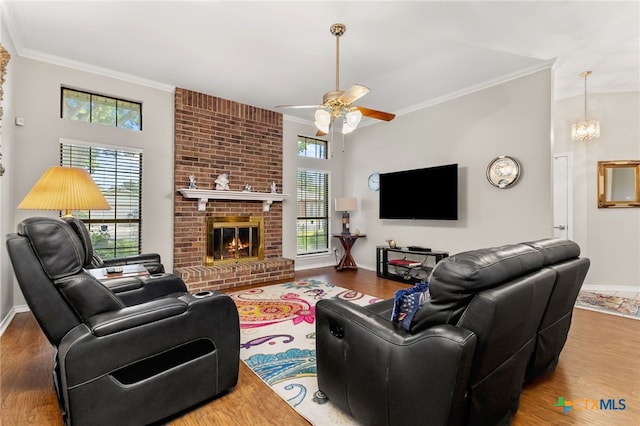1207 Old Homestead, Seguin, TX 78155 - living room with ornamental molding, a ceiling fan, wood finished floors, and a fireplace