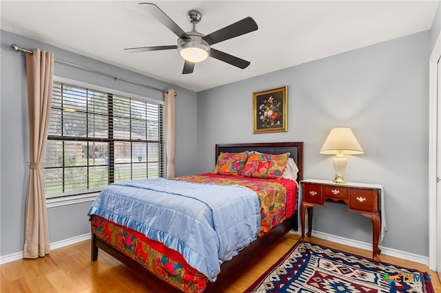1207 Old Homestead, Seguin, TX 78155 - bedroom with multiple windows and wood finished floors