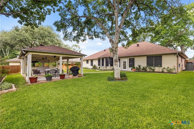 1207 Old Homestead, Seguin, TX 78155 - rear view of house with ceiling fan, a patio area, and a shingled roof