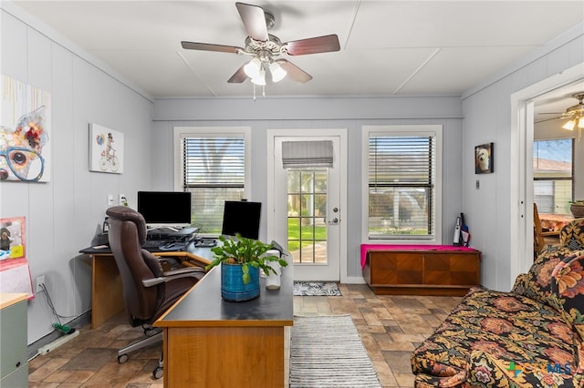 1207 Old Homestead, Seguin, TX 78155 - home office featuring ceiling fan, plenty of natural light, and stone finish flooring