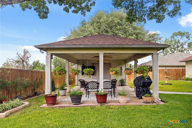 1207 Old Homestead, Seguin, TX 78155 - fenced backyard featuring a ceiling fan, a grill, and a patio area