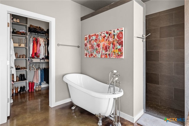 bathroom featuring separate shower and tub and concrete floors