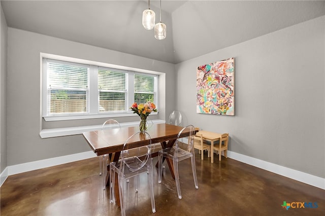 dining room featuring vaulted ceiling