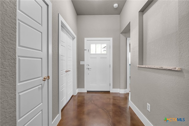 entryway with a textured ceiling