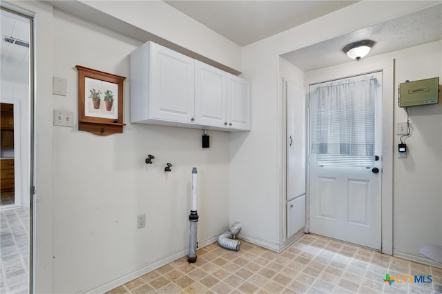 washroom featuring cabinets