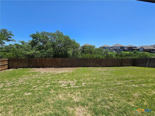 view of yard with fence