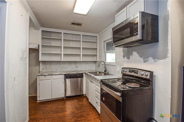 202 Margaret Lee St, Copperas Cove, TX 76522 - kitchen with stainless steel appliances, open shelves, backsplash, white cabinetry, and dark wood-style flooring