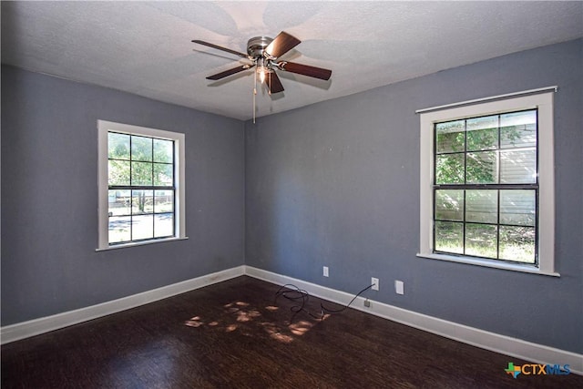 202 Margaret Lee St, Copperas Cove, TX 76522 - empty room with dark wood-type flooring, plenty of natural light, ceiling fan, and a textured ceiling