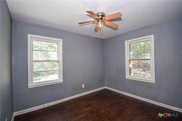 202 Margaret Lee St, Copperas Cove, TX 76522 - empty room featuring dark wood-style flooring, healthy amount of natural light, and a ceiling fan