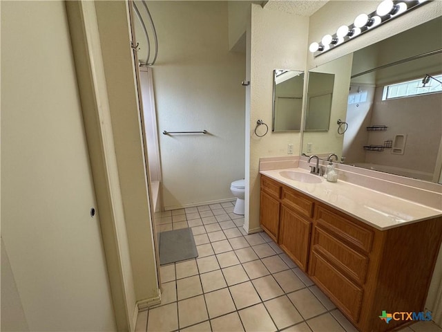 full bath with shower / washtub combination, tile patterned flooring, vanity, and toilet