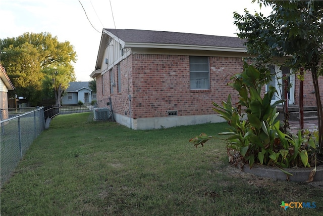 view of home's exterior with a lawn