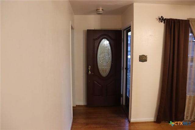 interior space with dark hardwood / wood-style flooring