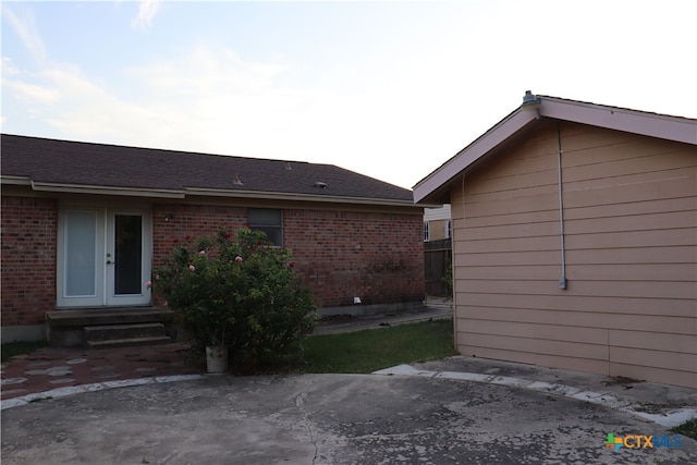 rear view of property featuring french doors