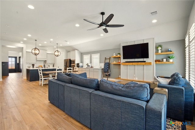 1911 Peres St, New Braunfels, TX 78132 - living room with ceiling fan, healthy amount of natural light, light wood-type flooring, and recessed lighting