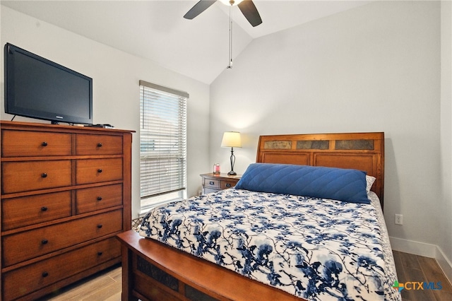 1911 Peres St, New Braunfels, TX 78132 - bedroom featuring lofted ceiling, light wood-style floors, baseboards, and a ceiling fan