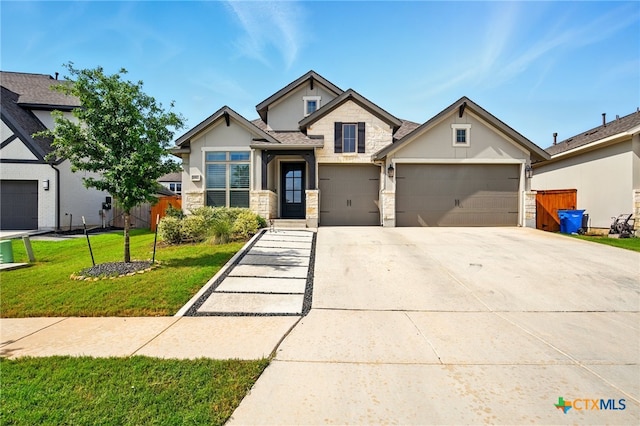 1911 Peres St, New Braunfels, TX 78132 - view of front of property featuring stone siding, concrete driveway, stucco siding, and an attached garage