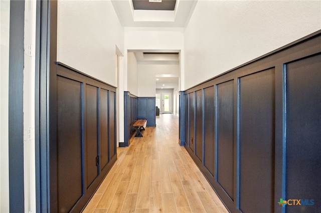 1911 Peres St, New Braunfels, TX 78132 - foyer featuring light wood finished floors, wainscoting, and a decorative wall