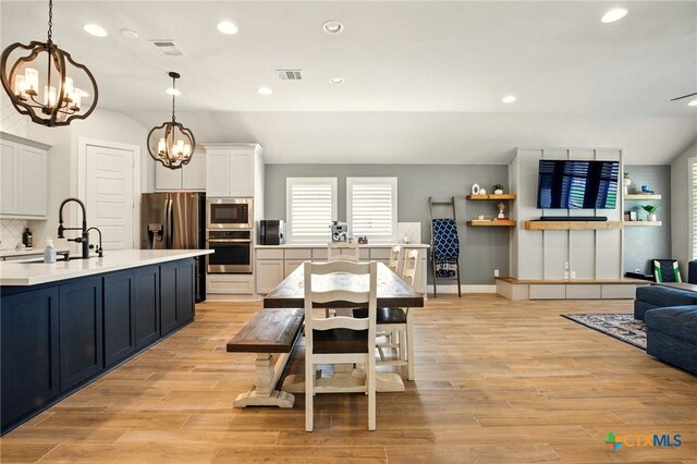 1911 Peres St, New Braunfels, TX 78132 - dining area featuring a chandelier, recessed lighting, and light wood-style floors