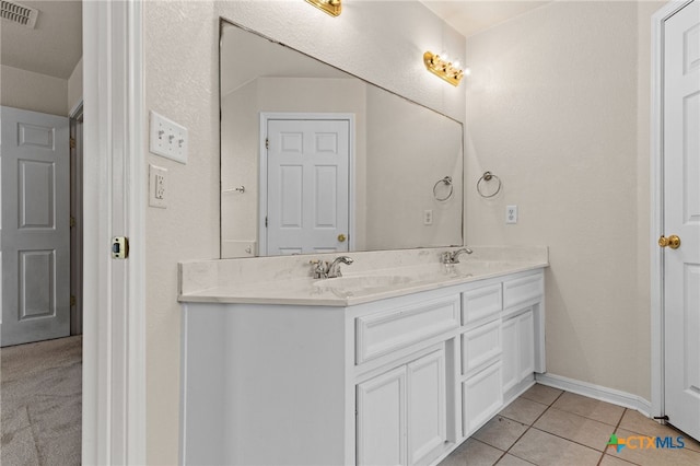 3102 Wisteria Ln, Killeen, TX 76549 - bathroom featuring double vanity and tile patterned floors