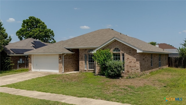 3102 Wisteria Ln, Killeen, TX 76549 - ranch-style home with brick siding, driveway, an attached garage, and a shingled roof