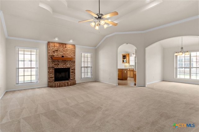 3102 Wisteria Ln, Killeen, TX 76549 - unfurnished living room with plenty of natural light, arched walkways, light carpet, and crown molding