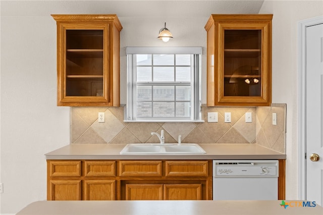 3102 Wisteria Ln, Killeen, TX 76549 - kitchen featuring dishwasher, brown cabinets, glass insert cabinets, and light countertops
