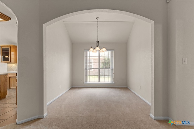 3102 Wisteria Ln, Killeen, TX 76549 - empty room featuring a chandelier, light carpet, and arched walkways