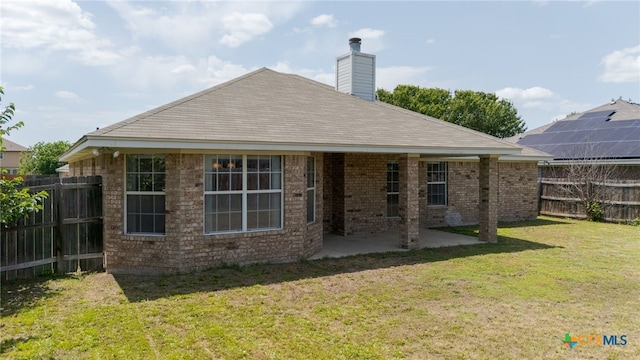 3102 Wisteria Ln, Killeen, TX 76549 - rear view of property with a fenced backyard, a patio area, a chimney, and brick siding