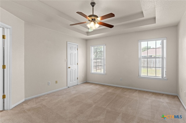 3102 Wisteria Ln, Killeen, TX 76549 - carpeted spare room with a tray ceiling and a ceiling fan