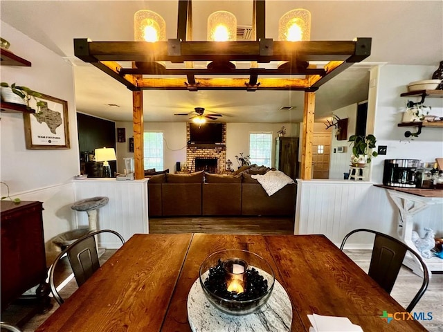 108 Elaine St, Victoria, TX 77904 - dining area with ceiling fan, wood finished floors, and a fireplace
