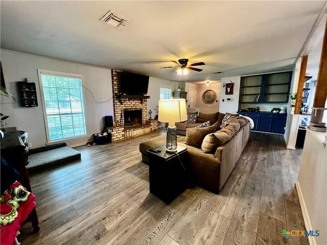 108 Elaine St, Victoria, TX 77904 - living area featuring wood finished floors, visible vents, and a wealth of natural light