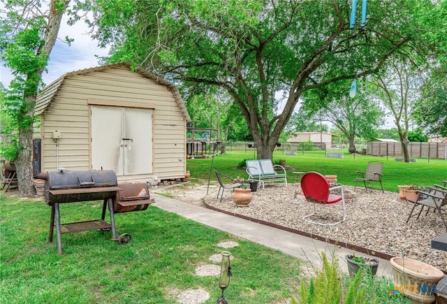 108 Elaine St, Victoria, TX 77904 - view of yard with an outdoor structure, a shed, and fence