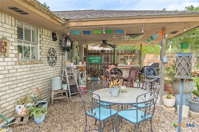 108 Elaine St, Victoria, TX 77904 - view of patio / terrace with a ceiling fan, outdoor dining area, and fence