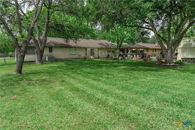 108 Elaine St, Victoria, TX 77904 - exterior space featuring central air condition unit and a front yard