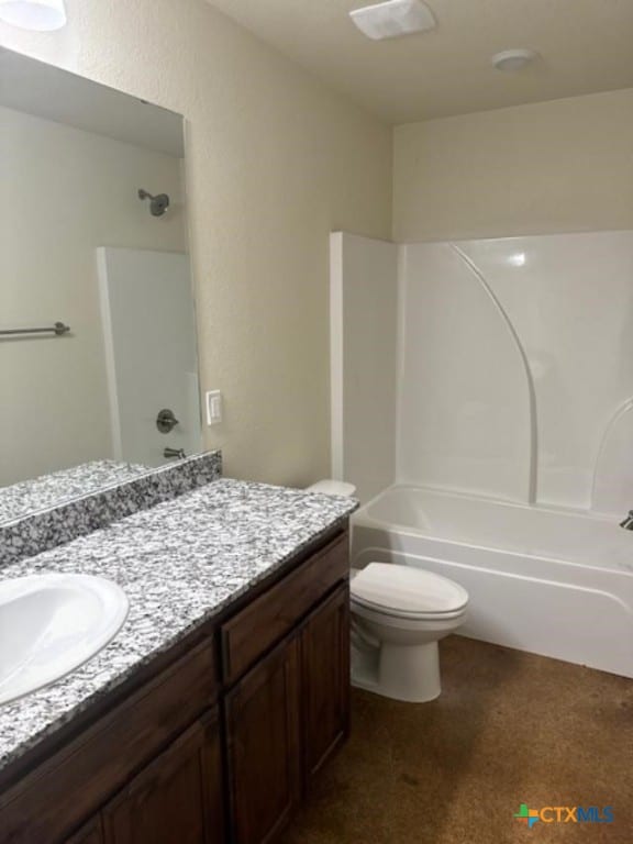 full bathroom featuring  shower combination, vanity, and toilet