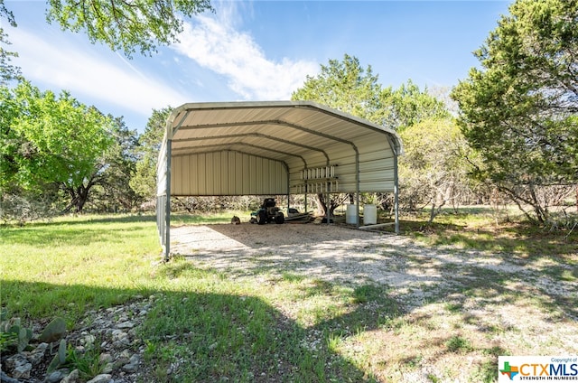 view of car parking featuring a lawn and a carport