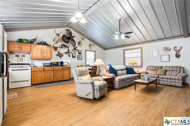 living room with ceiling fan, lofted ceiling, and light hardwood / wood-style floors