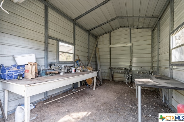 garage featuring wood walls