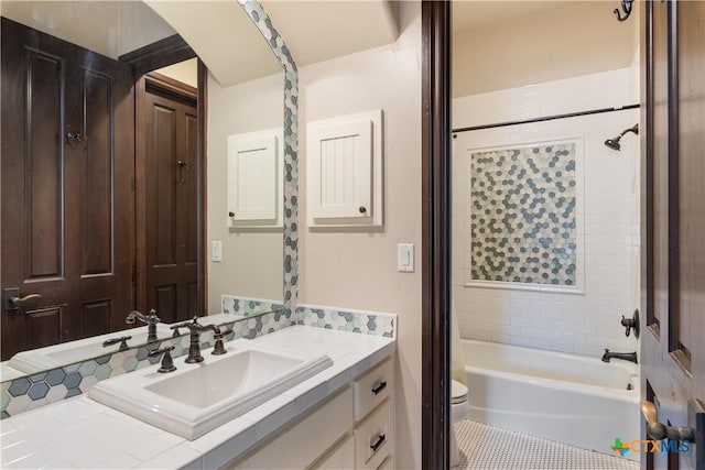 full bathroom featuring tile patterned flooring, shower / bath combo, vanity, and toilet